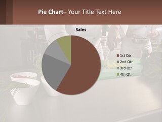 A Group Of Chefs Preparing Food In A Kitchen PowerPoint Template