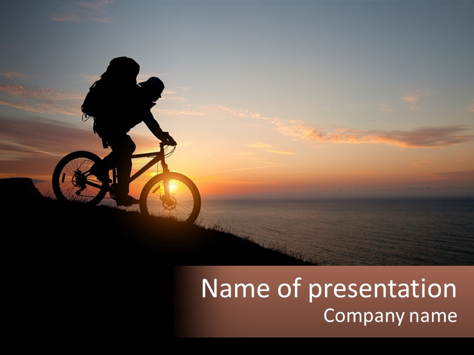 A Person Riding A Bike On Top Of A Hill PowerPoint Template