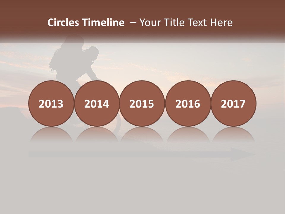 A Person Riding A Bike On Top Of A Hill PowerPoint Template