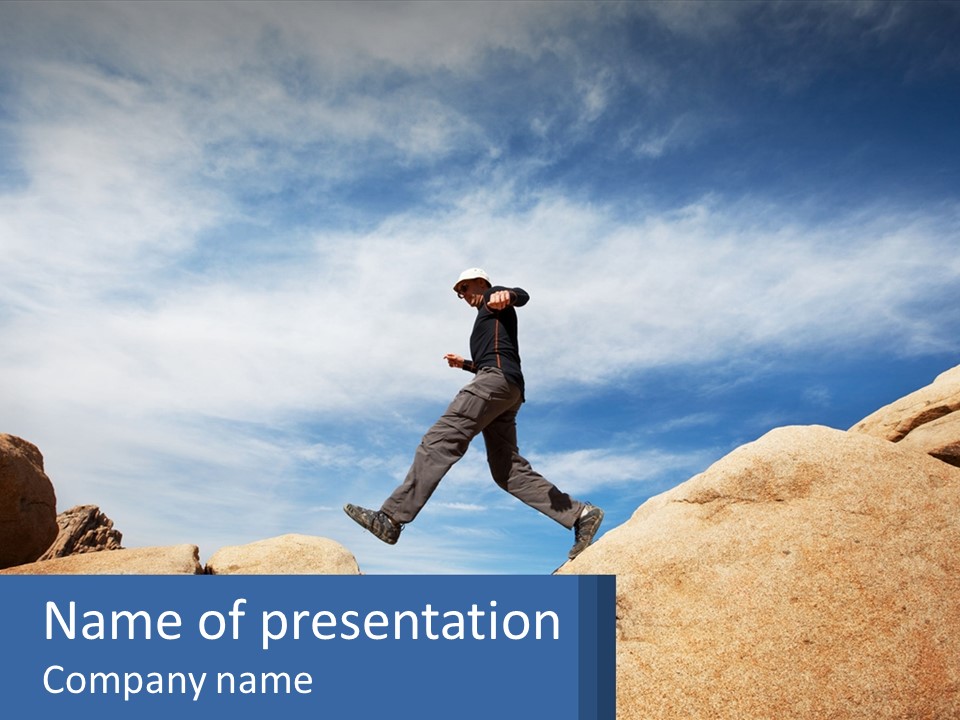 A Man Jumping Over A Large Rock On A Sunny Day PowerPoint Template