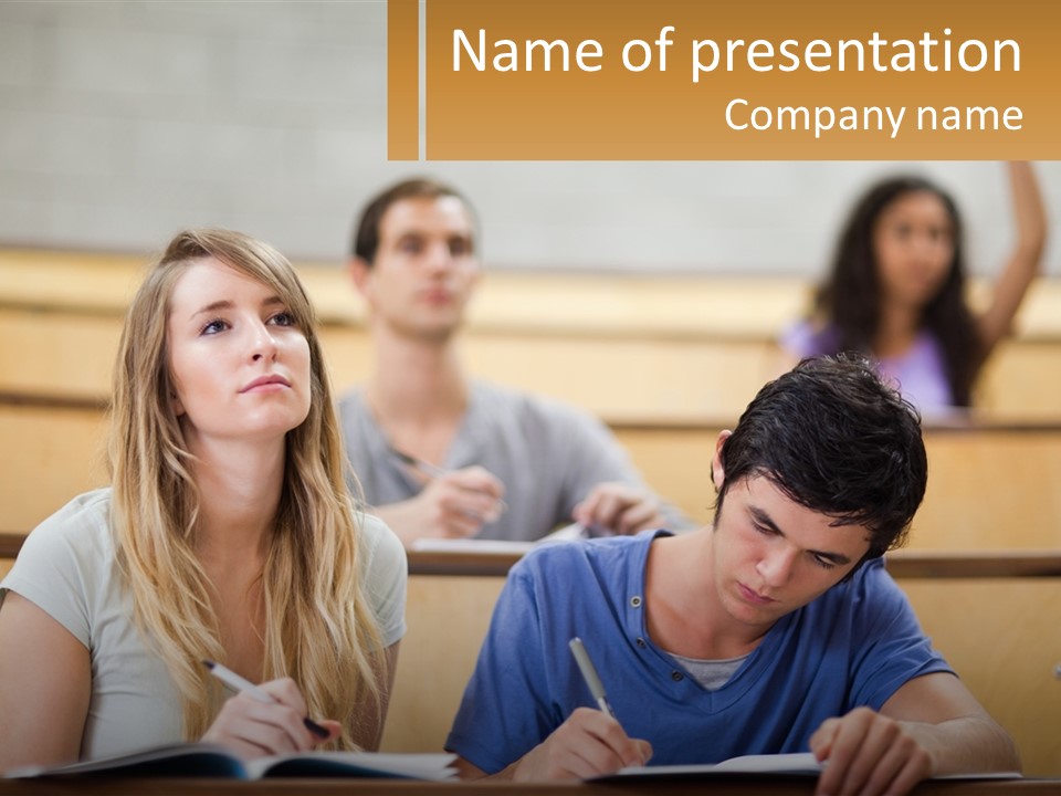 A Group Of People Sitting In A Lecture Hall PowerPoint Template