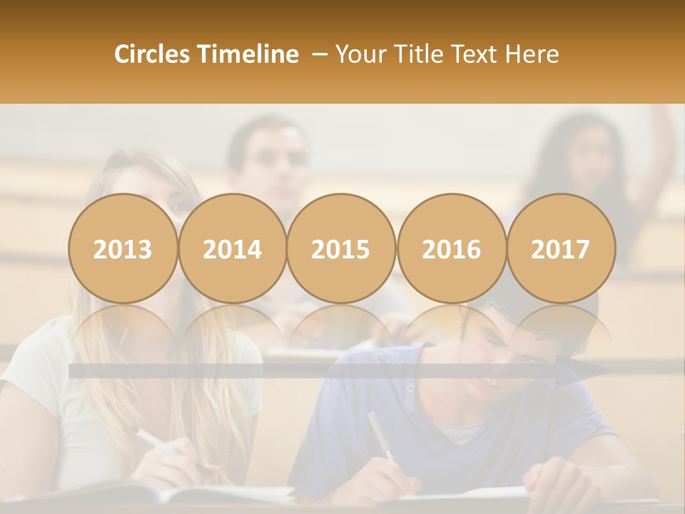 A Group Of People Sitting In A Lecture Hall PowerPoint Template