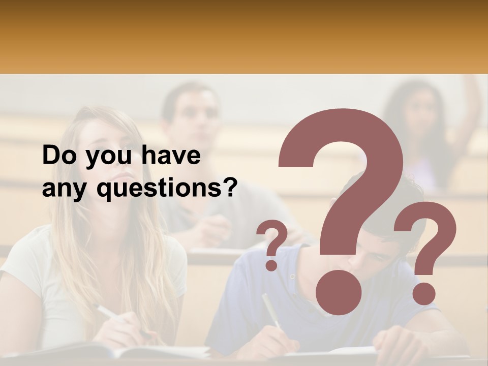 A Group Of People Sitting In A Lecture Hall PowerPoint Template
