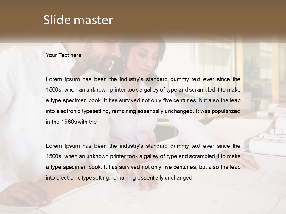 A Man And Woman Sitting At A Desk In An Office PowerPoint Template