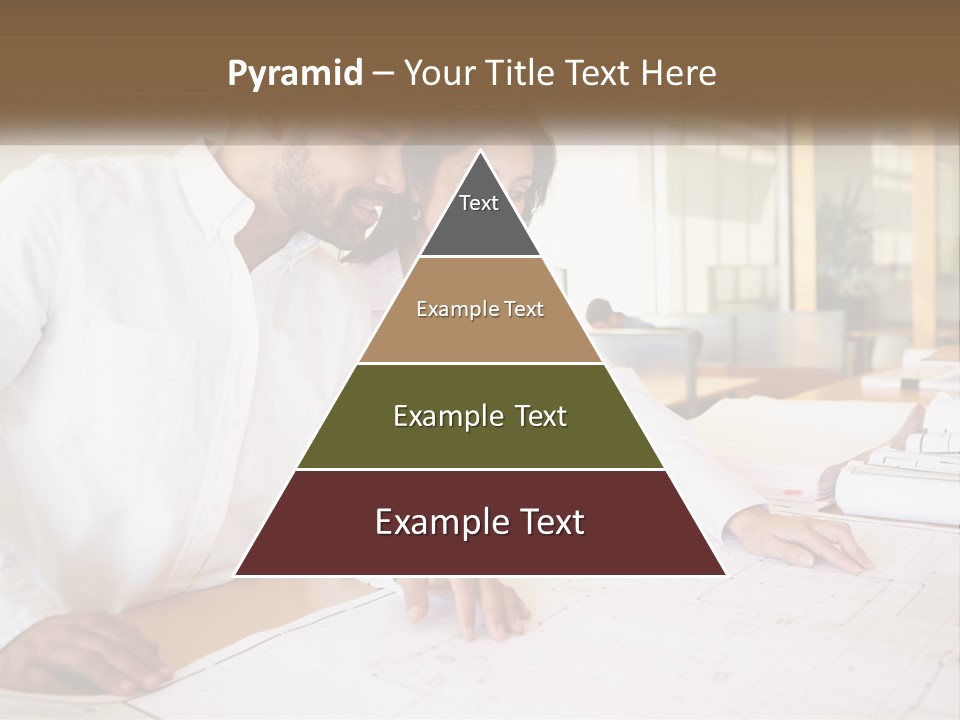 A Man And Woman Sitting At A Desk In An Office PowerPoint Template