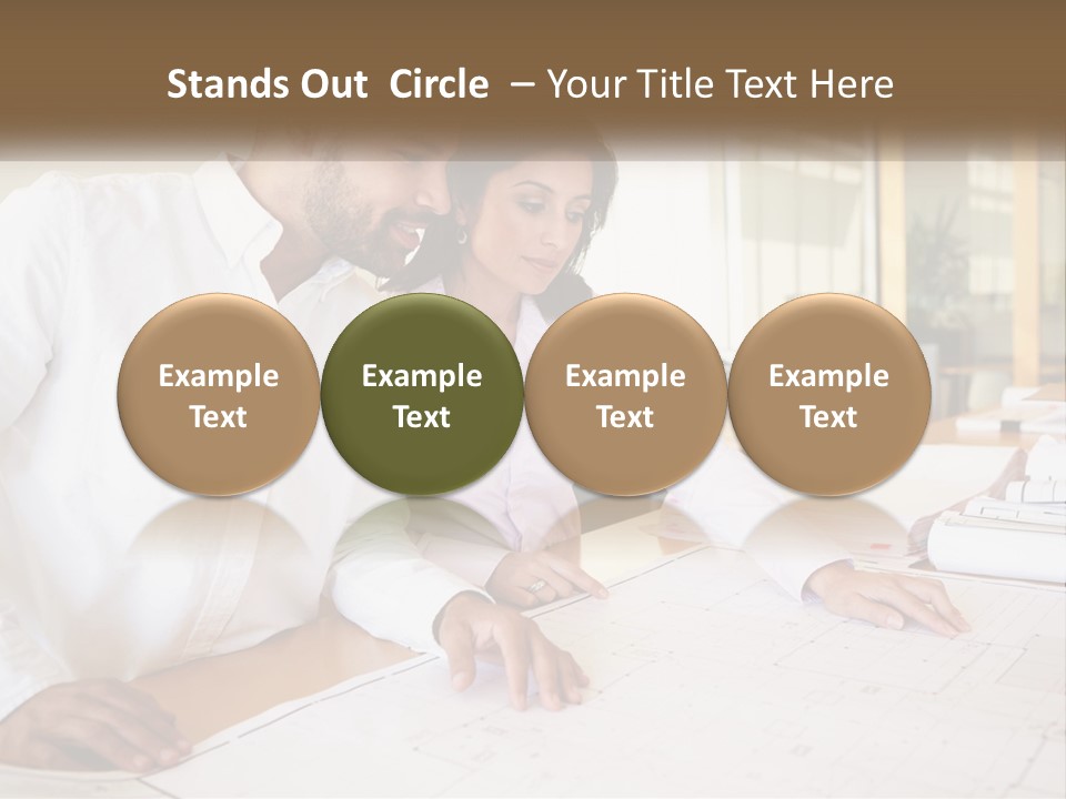 A Man And Woman Sitting At A Desk In An Office PowerPoint Template