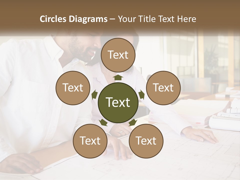 A Man And Woman Sitting At A Desk In An Office PowerPoint Template