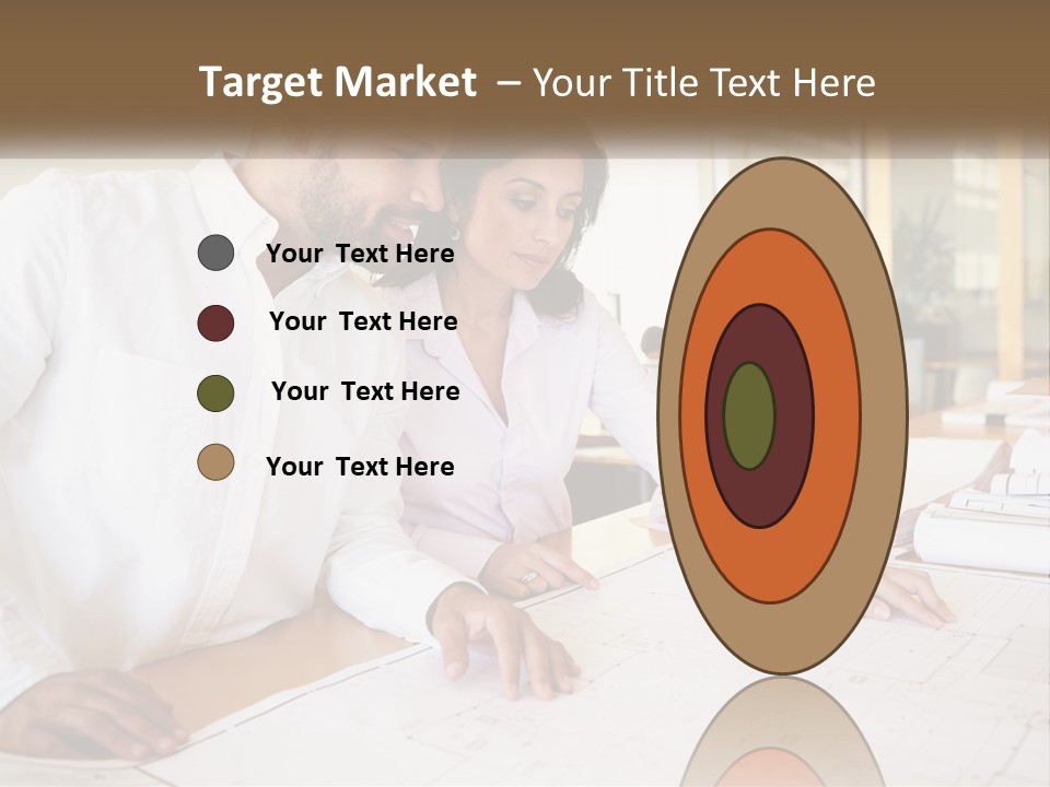 A Man And Woman Sitting At A Desk In An Office PowerPoint Template