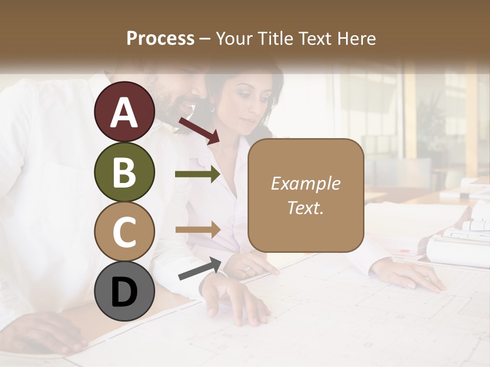 A Man And Woman Sitting At A Desk In An Office PowerPoint Template