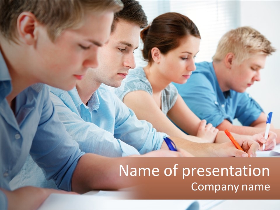 A Group Of People Sitting At A Table Writing PowerPoint Template