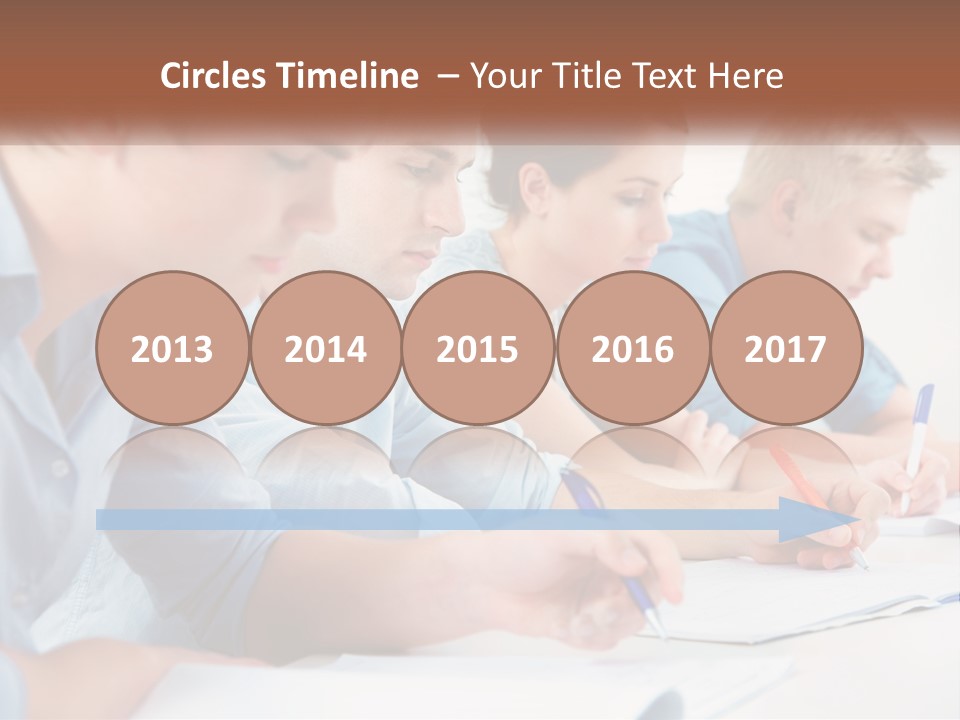 A Group Of People Sitting At A Table Writing PowerPoint Template