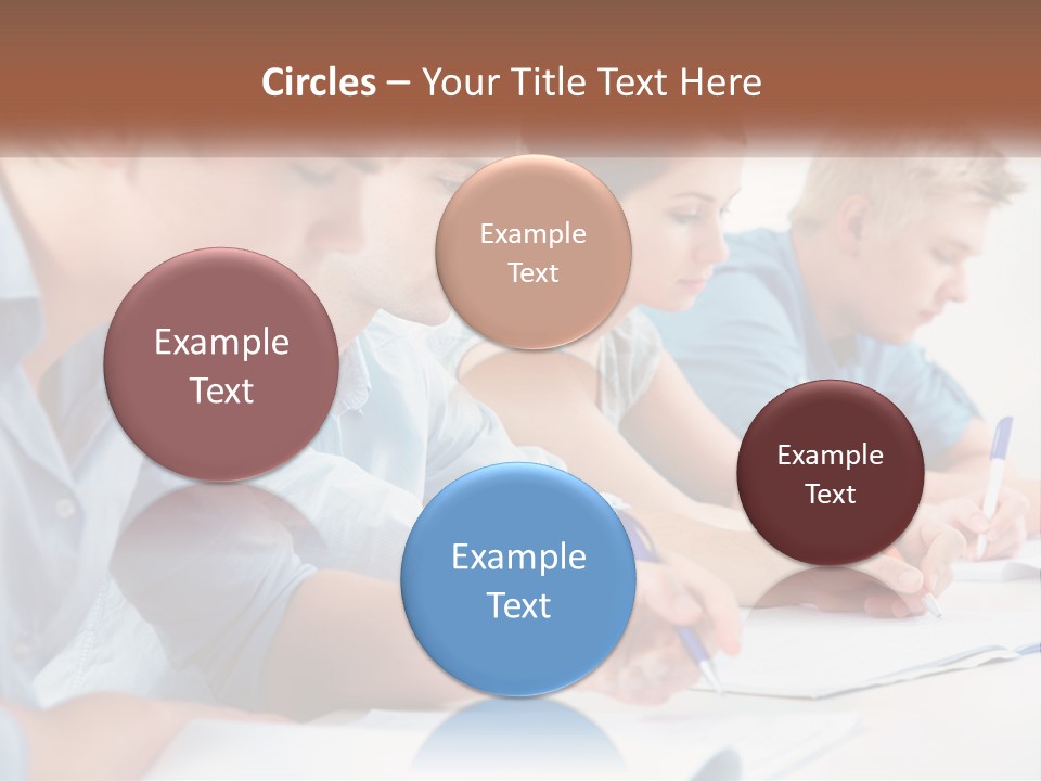 A Group Of People Sitting At A Table Writing PowerPoint Template