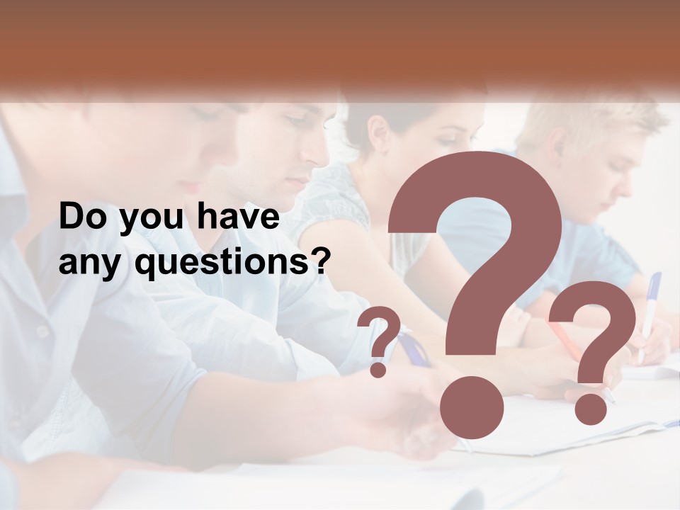 A Group Of People Sitting At A Table Writing PowerPoint Template