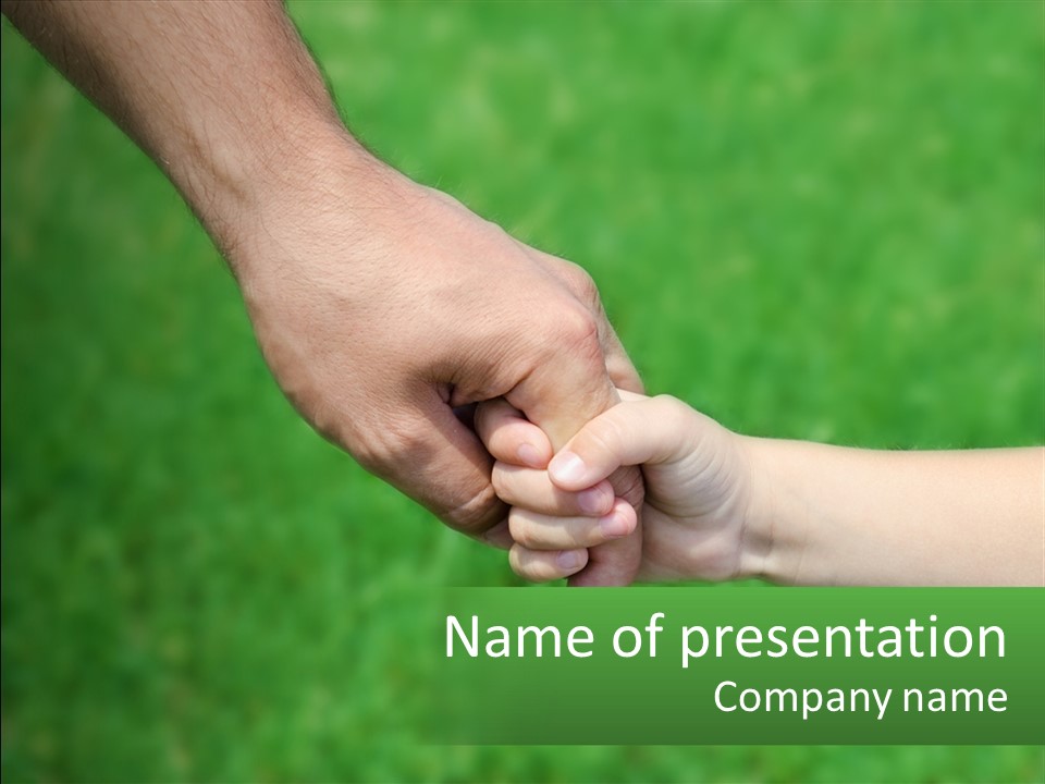 A Man Holding A Small Child's Hand In Front Of A Green Field PowerPoint Template