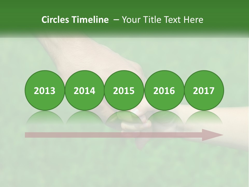 A Man Holding A Small Child's Hand In Front Of A Green Field PowerPoint Template