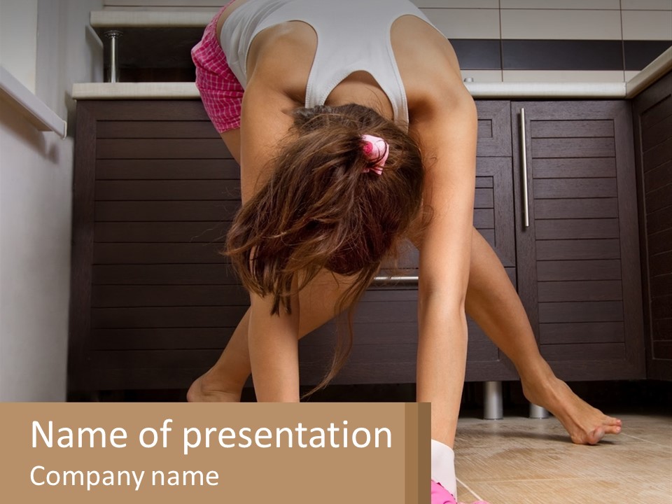 A Woman Bending Over On The Floor In A Kitchen PowerPoint Template