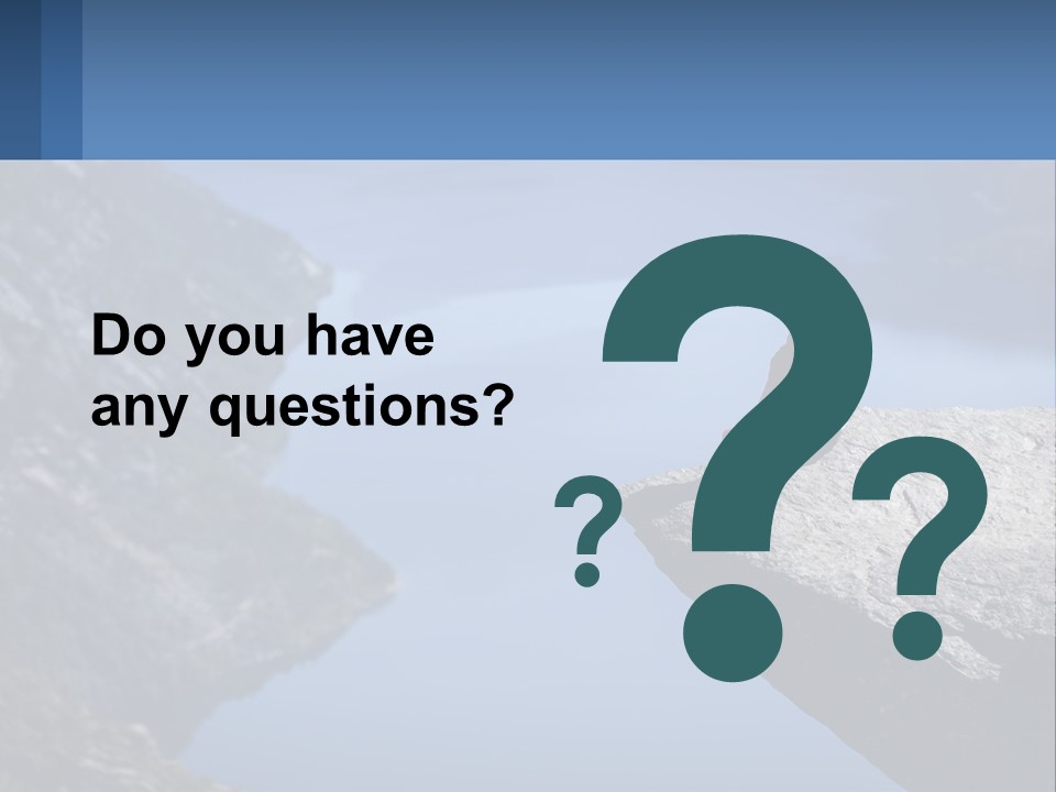 A Person Sitting On Top Of A Cliff Overlooking A Lake PowerPoint Template