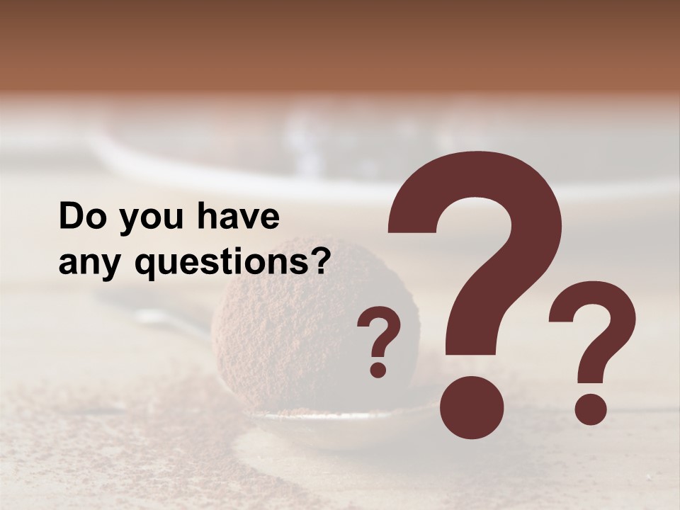 A Spoon Full Of Chocolate Powder Next To A Plate Of Chocolate Balls PowerPoint Template