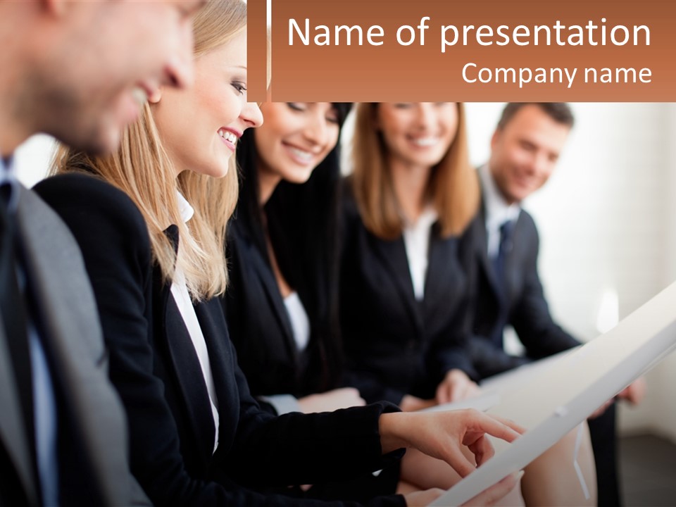 A Group Of Business People Sitting At A Table PowerPoint Template