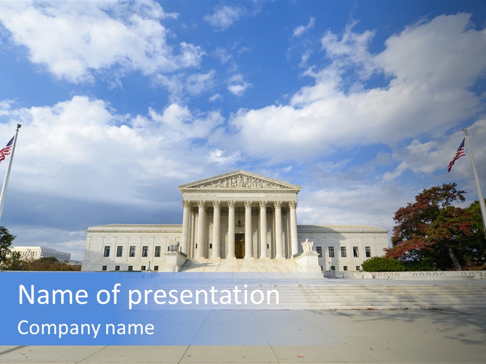 A Large Building With Columns And Flags In Front Of It PowerPoint Template
