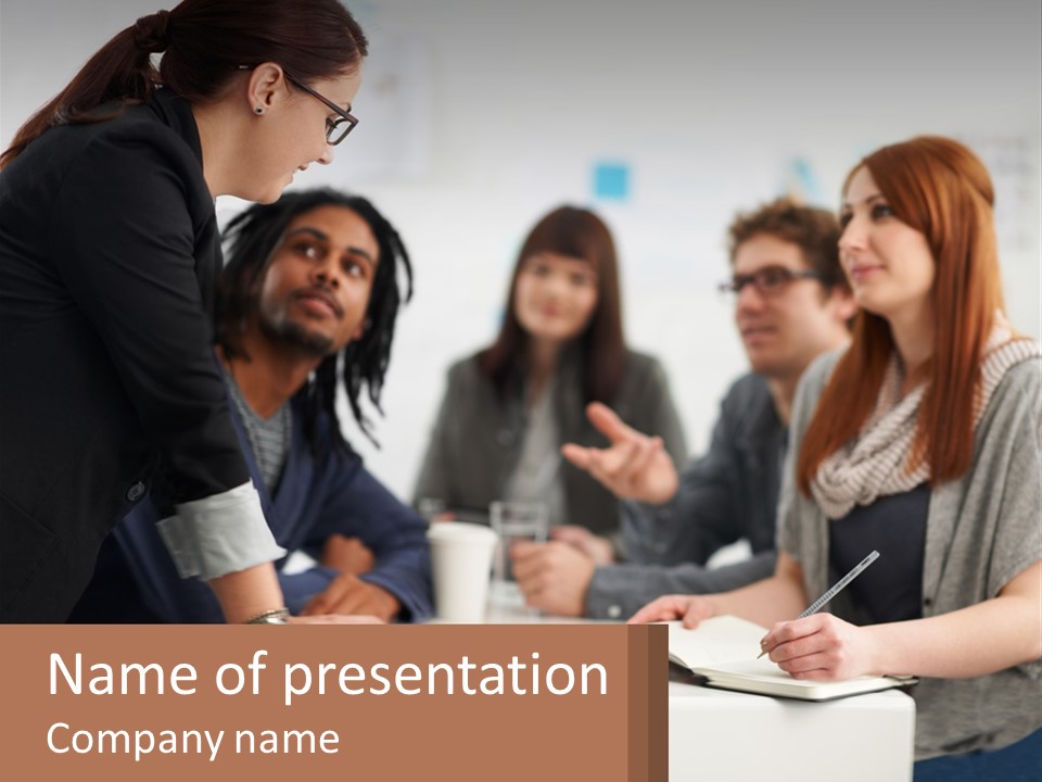A Group Of People Sitting Around A Table Talking PowerPoint Template