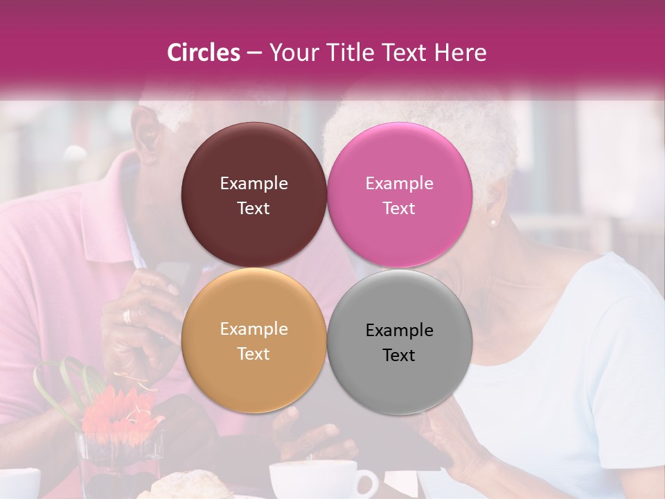 A Man And Woman Sitting At A Table Looking At A Tablet PowerPoint Template
