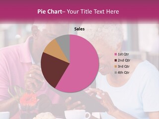 A Man And Woman Sitting At A Table Looking At A Tablet PowerPoint Template