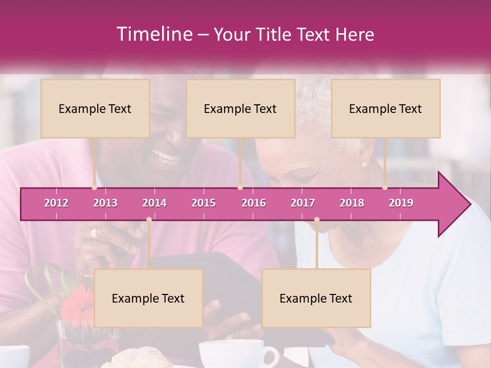 A Man And Woman Sitting At A Table Looking At A Tablet PowerPoint Template
