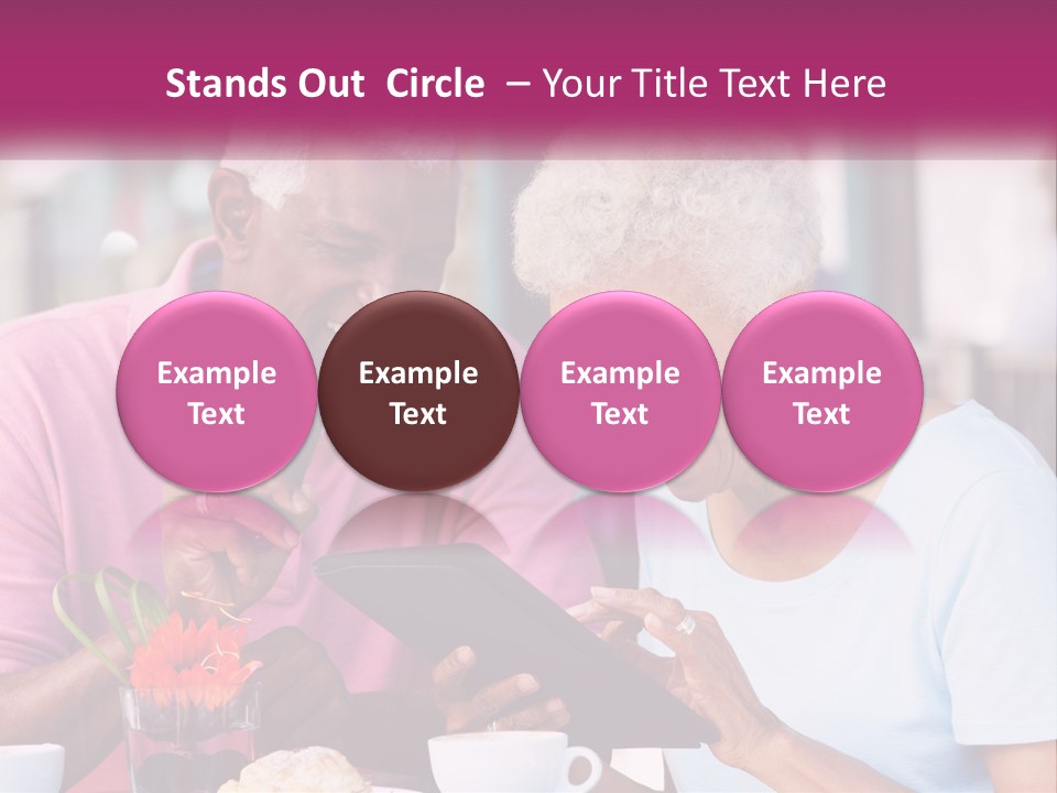A Man And Woman Sitting At A Table Looking At A Tablet PowerPoint Template