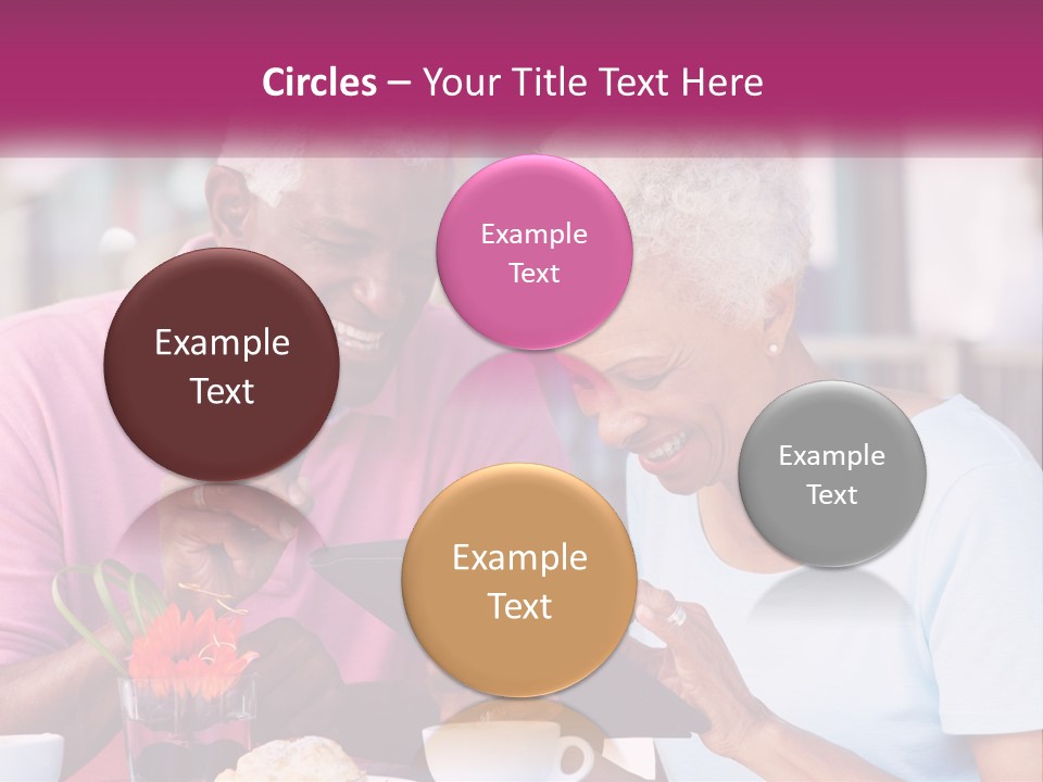 A Man And Woman Sitting At A Table Looking At A Tablet PowerPoint Template
