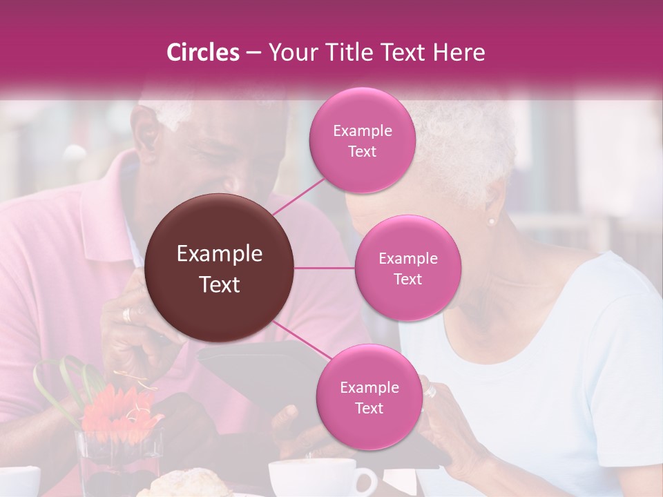 A Man And Woman Sitting At A Table Looking At A Tablet PowerPoint Template