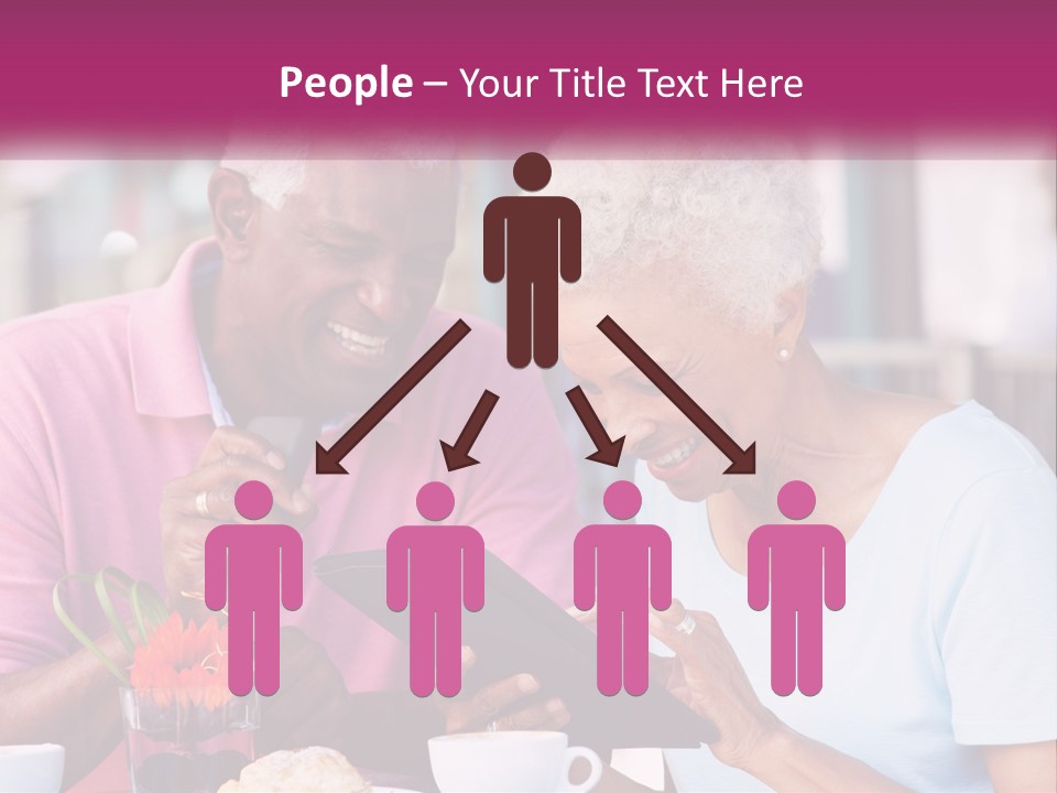 A Man And Woman Sitting At A Table Looking At A Tablet PowerPoint Template