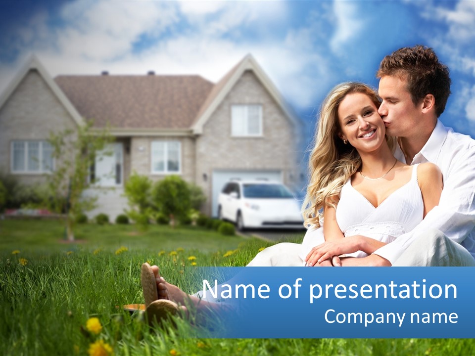 A Man And Woman Sitting In The Grass In Front Of A House PowerPoint Template