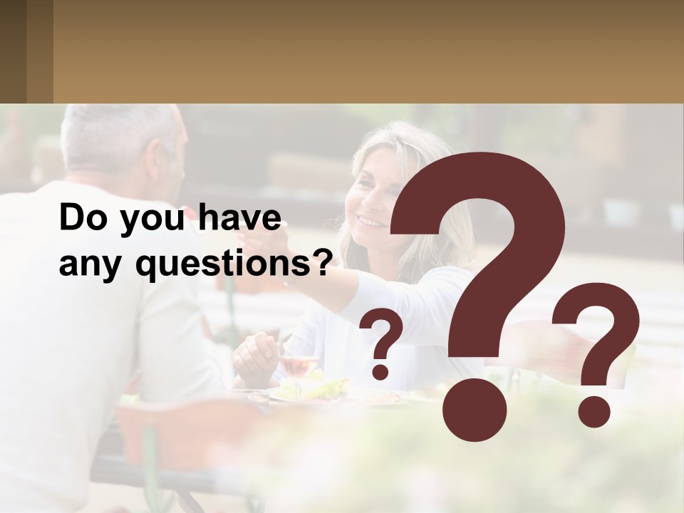 A Man And A Woman Sitting At A Table Eating Food PowerPoint Template
