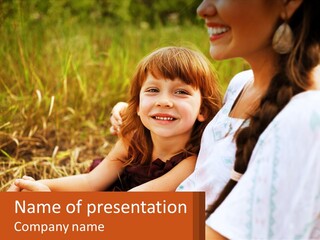 A Woman Sitting Next To A Little Girl In A Field PowerPoint Template