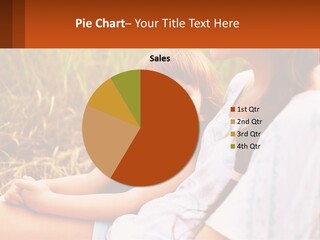 A Woman Sitting Next To A Little Girl In A Field PowerPoint Template