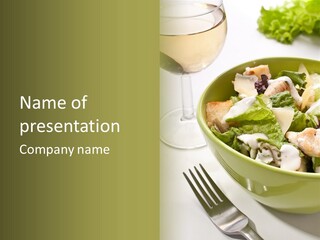 A Green Bowl Filled With Salad Next To A Glass Of Wine PowerPoint Template