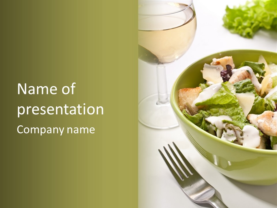A Green Bowl Filled With Salad Next To A Glass Of Wine PowerPoint Template