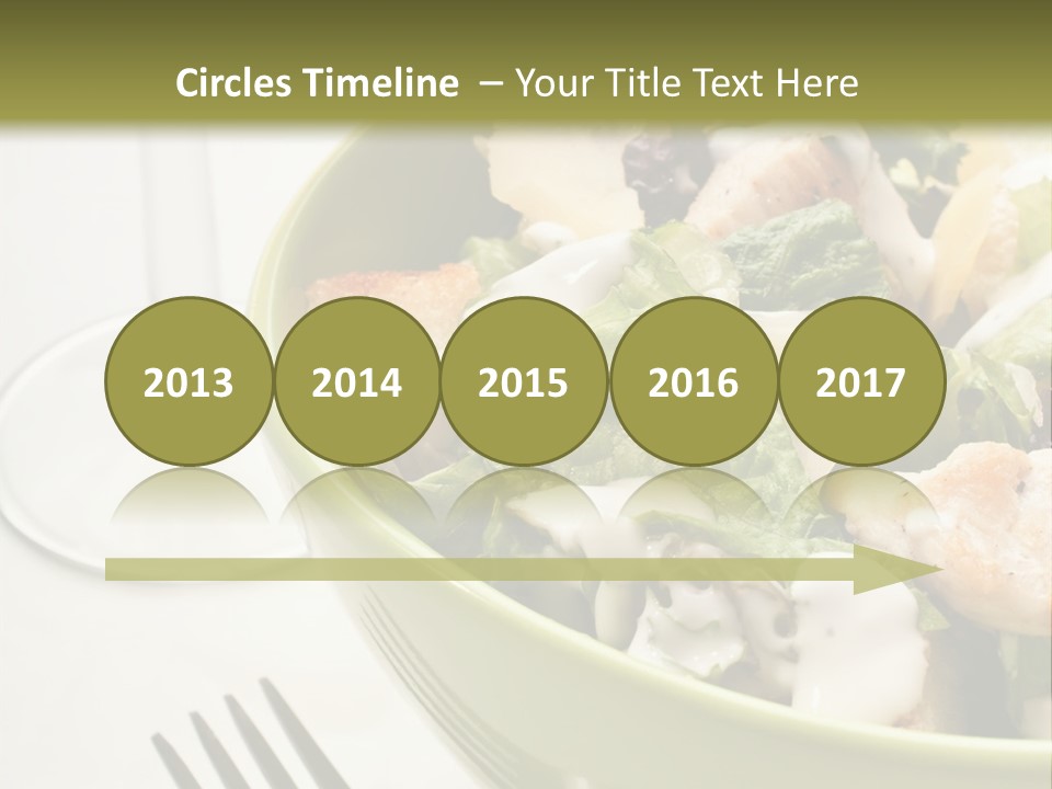 A Green Bowl Filled With Salad Next To A Glass Of Wine PowerPoint Template