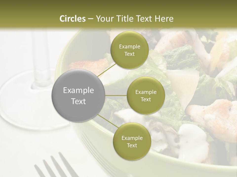 A Green Bowl Filled With Salad Next To A Glass Of Wine PowerPoint Template