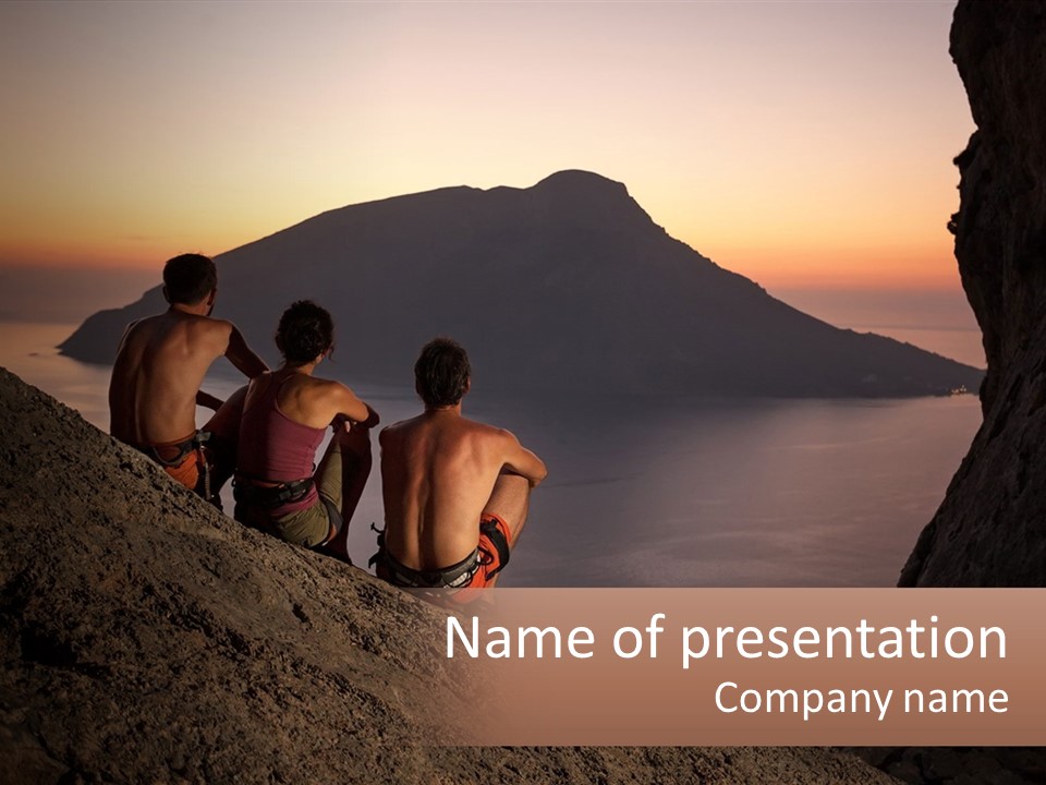 Two Men Sitting On A Cliff Overlooking A Body Of Water PowerPoint Template