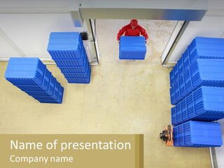 A Man In A Red Jacket Is Standing Next To A Bunch Of Blue Crates PowerPoint Template