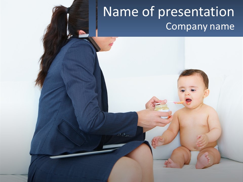 A Woman Feeding A Baby With A Spoon PowerPoint Template