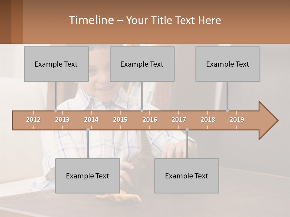 A Young Boy Sitting At A Table With A Toy PowerPoint Template
