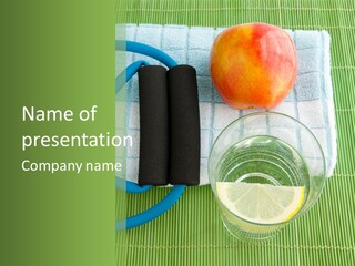 A Glass Of Water, Lemon, And A Piece Of Fruit On A Mat PowerPoint Template