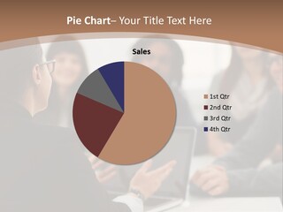 A Group Of People Sitting At A Table With A Laptop PowerPoint Template