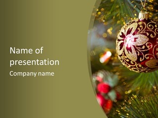 A Christmas Ornament Hanging From A Tree PowerPoint Template