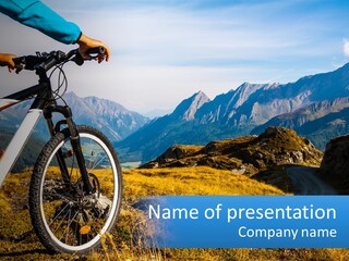 A Person Riding A Bike In The Mountains PowerPoint Template
