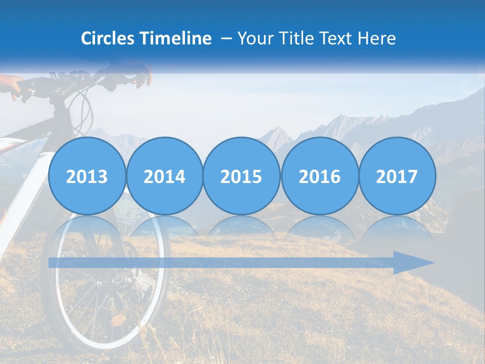 A Person Riding A Bike In The Mountains PowerPoint Template