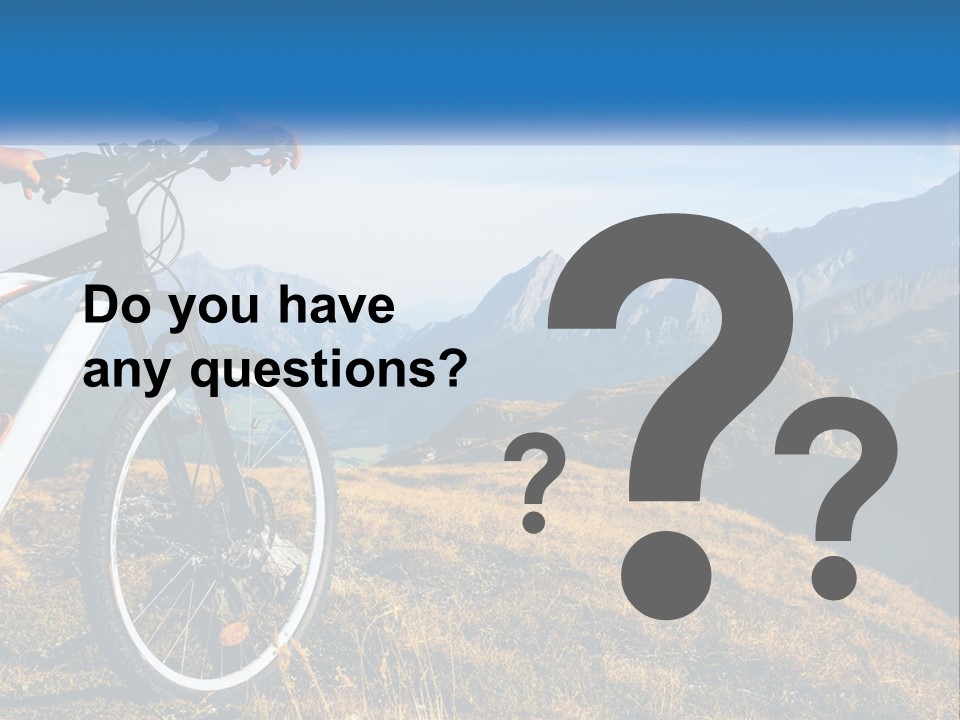 A Person Riding A Bike In The Mountains PowerPoint Template